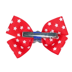 Handmade American flag bow hair clip with white stars on red ribbon for girls