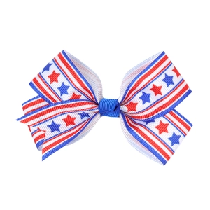 Detailed close-up of girls grosgrain ribbon bow hair clip with USA flag stars and stripes