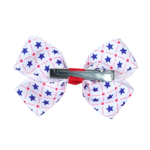 Independence Day hair bow clip with blue stars and red grid patterns on white fabric