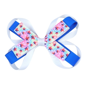Detail of multi-layered Independence Day hair bow with stars and stripes pattern