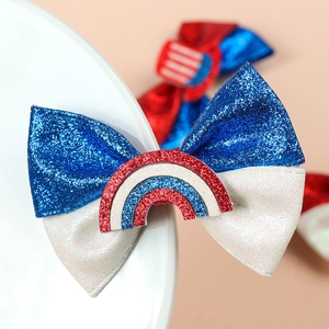 Independence Day hair bow with red white and blue glitter and a rainbow center