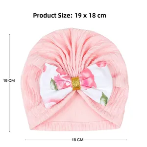 Detailed view of baby turban hat showing product dimensions 18cm by 19cm in pink