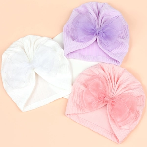 Three-piece baby turban hat set with large organza bows in white, pink, and light purple