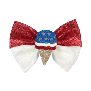 Detailed view of Independence Day glitter hair bow with ice cream cone star ornament
