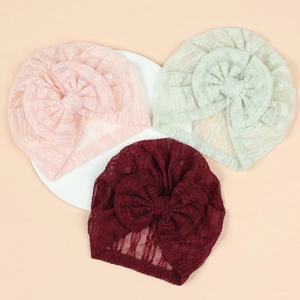Newborn lace bow turbans in pink, mint green, and burgundy with breathable mesh material