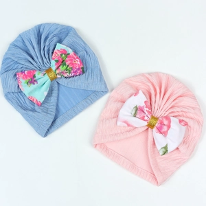 Newborn baby turban hats in pink and blue with floral bows and gold sequin accents