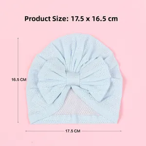 Breathable baby turban hat in light blue with large bow detail measuring 17.5cm by 16.5cm
