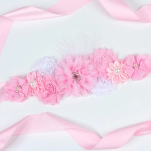 Pink floral maternity sash for pregnancy photoshoot with delicate chiffon flowers and pearls