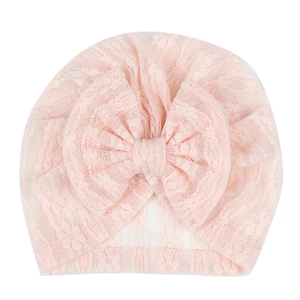 Pink newborn lace turban hat with large bow decoration for infants and baby girls