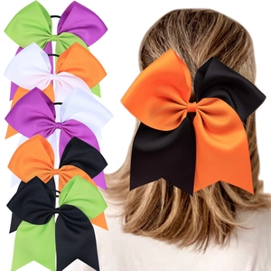 Macro detail of large Halloween themed dual-tone grosgrain ribbon cheer bow with elastic band