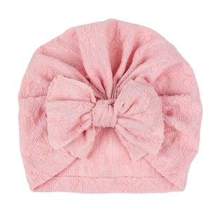 Breathable lace baby turban hat with a large bow in light pink for infant girls