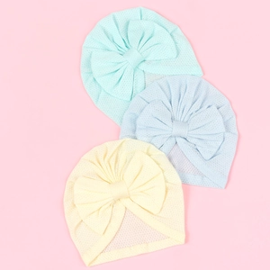 Breathable mesh baby turban set with large bow detail in light green, blue, and yellow colors