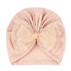Detail of baby turban hat with large layered organza bow and soft ribbed texture
