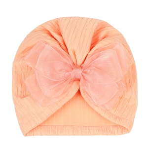 Close-up of baby turban showing the ribbed knit fabric and big tulle bow detail
