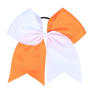 Detail of large Halloween grosgrain bow with orange and white two-tone ribbon on elastic band