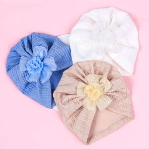 Three-piece set of baby jacquard turban hats with large organza flowers in blue and pink