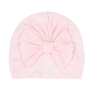 Detail view of pink baby turban hat showing breathable mesh fabric and large bow decoration
