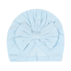 Detail of light blue baby turban hat with oversized bow and breathable mesh fabric texture