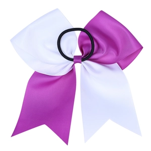 Detail view of purple and white striped grosgrain bow with black elastic hair tie