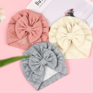 Three-piece baby bow turban hats in pink, beige, and grey waffle knit fabrics