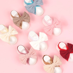 Detail of 8-color newborn knit bow headbands set with textured patterns and elastic bands