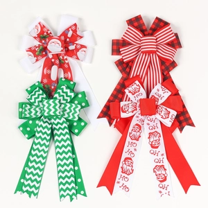 Kids Christmas ribbon hair bows with Santa patterns and festive dovetail design