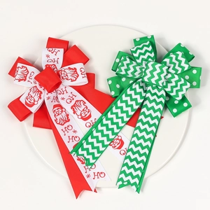 Christmas hair bows for girls with Santa Claus patterns and festive ribbons