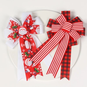 Christmas hair bows set with Santa Claus pattern and festive red ribbons for girls