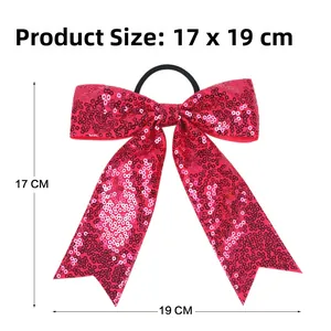 Detail view of large red sequin bow hair tie for girls with product size 17 X 19 CM