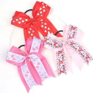 Three-piece set of girls' Valentine heart bow hair ties in red, blue, and pink grosgrain