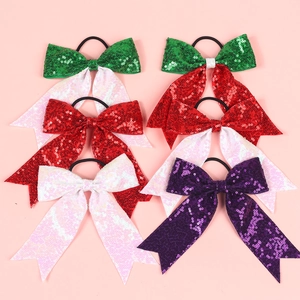 Detail of colorful sequined bow hair ties with elastic bands in six vibrant color patterns