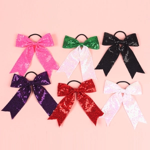 Set of six colorful sequin bow hair ties for girls in multiple vibrant glitter styles