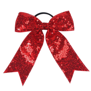 Detailed view of red sequin bow hair tie with layered swallowtail ribbon for girls