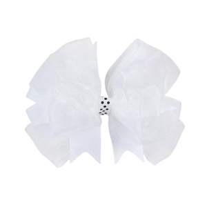 Détail du nœud blanc multicouche en organza et gros-grain avec centre à pois noirs