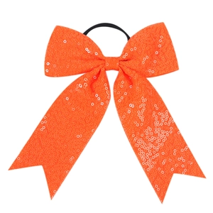 Detail of bright orange sequin bow hair tie with high-elasticity black rubber band