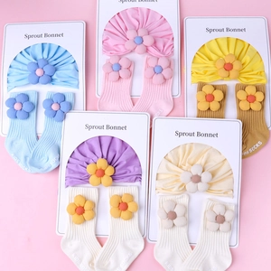 Knit baby hat and socks set with 3D floral accents in 5 pastel colors for infants