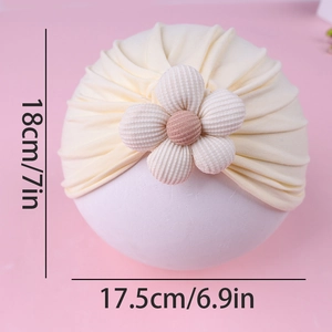 Detailed dimensions of cream cotton baby turban hat with decorative floral accent