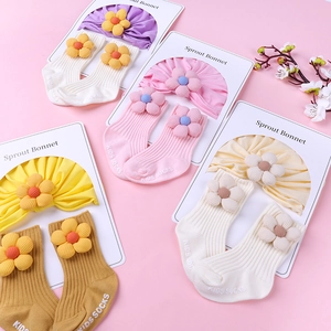 Infant cotton headband and socks set with 3D floral accents in multiple pastel colors