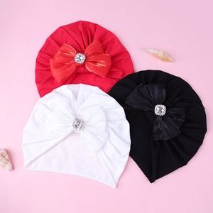 Détails de bandeaux bébé avec grands nœuds en satin et centres en strass brillants