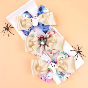 Lot de barrettes à cheveux Halloween avec nœuds citrouille et fantôme sur plateau blanc