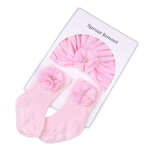Ensemble bandeau et chaussettes rose pour nouveau-né avec décorations florales