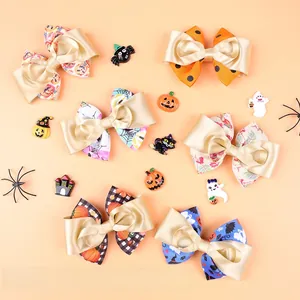 Détails des nœuds pour cheveux d'Halloween avec motifs citrouille et fantôme sur fond orange