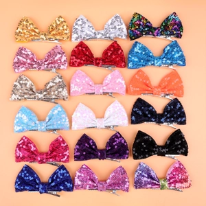 Set of 18 colorful 4-inch sequin bow hair clips for girls in a neat grid display