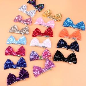 Array of colorful 4 inch glitter hair bows with metallic alligator clips for girls