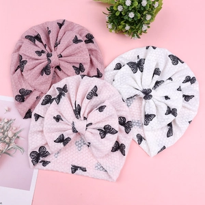 Infant turban hats with bow and butterfly pattern in pink and white knit fabric