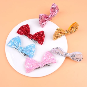 Set of 6 colorful 4-inch sequin bow hair clips for girls including red, pink and blue