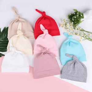 Newborn warm knitted beanie hats with adjustable knot detail in eight assorted colors