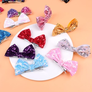 Detail view of 4-inch glitter hair bows with sequin finish and sturdy metal alligator clips