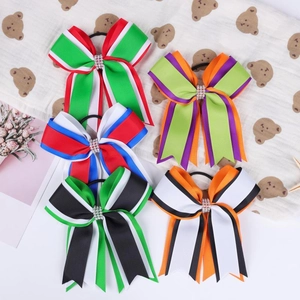 Haarelastiekjes met strik van grosgrain lint, strass en feestelijke kleurrijke patronen
