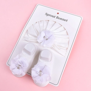 Ensemble bandeau et chaussettes bébé avec fleurs en maille, perles et strass sur rose
